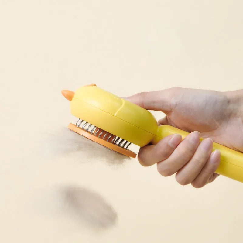 Purple pet grooming brush with self-cleaning button and stainless steel bristles for cats and dogs