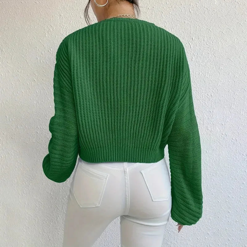 Women's solid colour long sleeve pullover in loose casual fit, shown in available colour options.