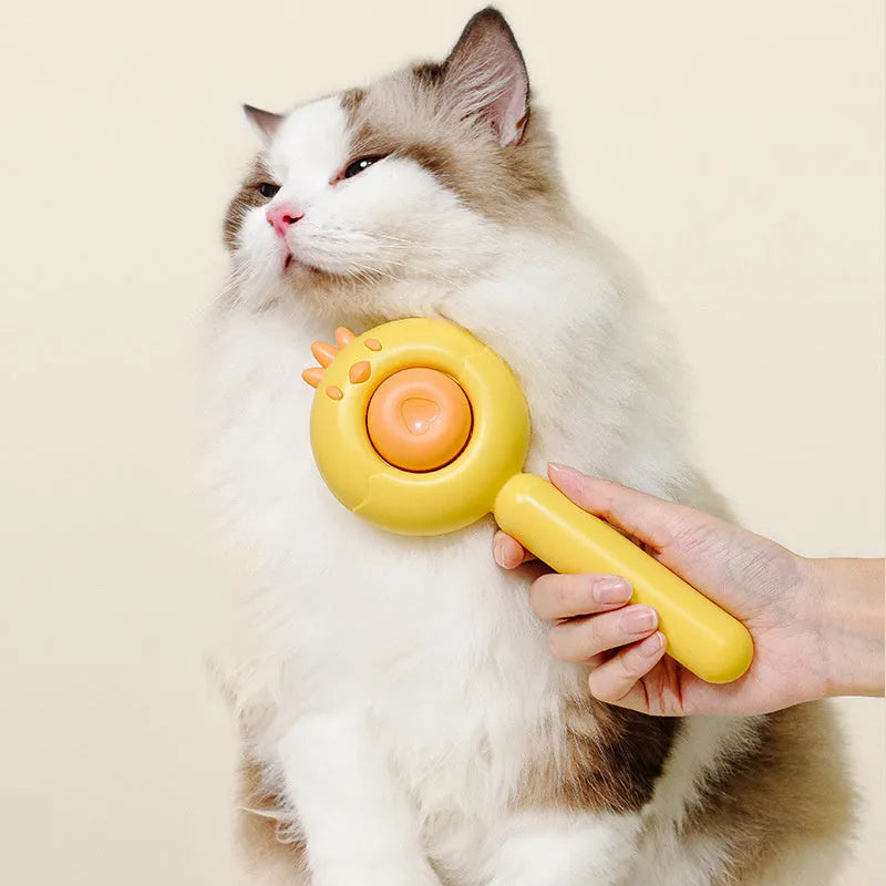 Purple pet grooming brush with self-cleaning button and stainless steel bristles for cats and dogs