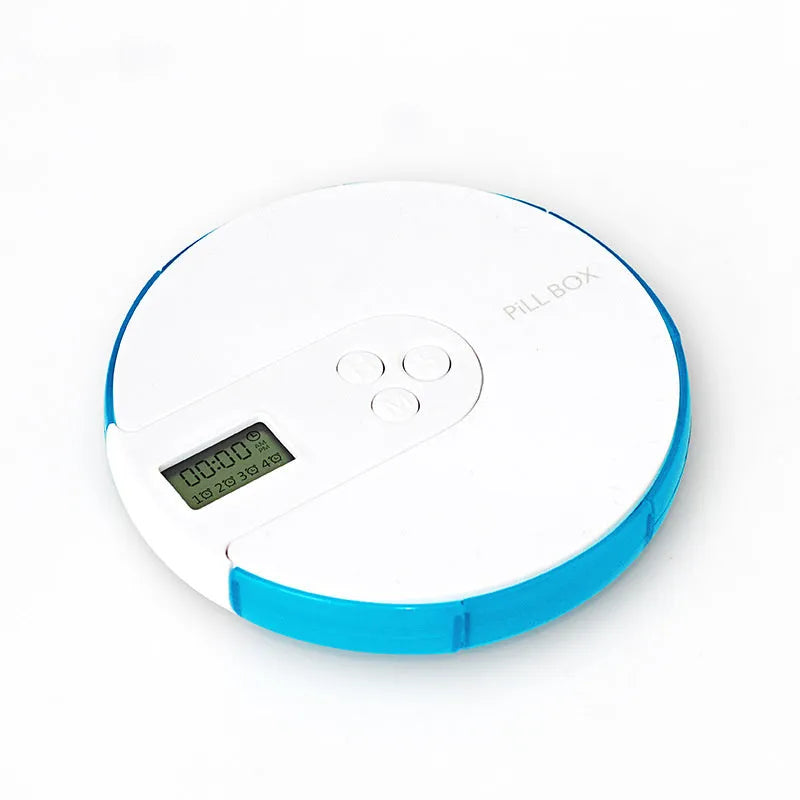 Blue 7-compartment alarm clock pill dispenser showing timer display and open lid with compartments.