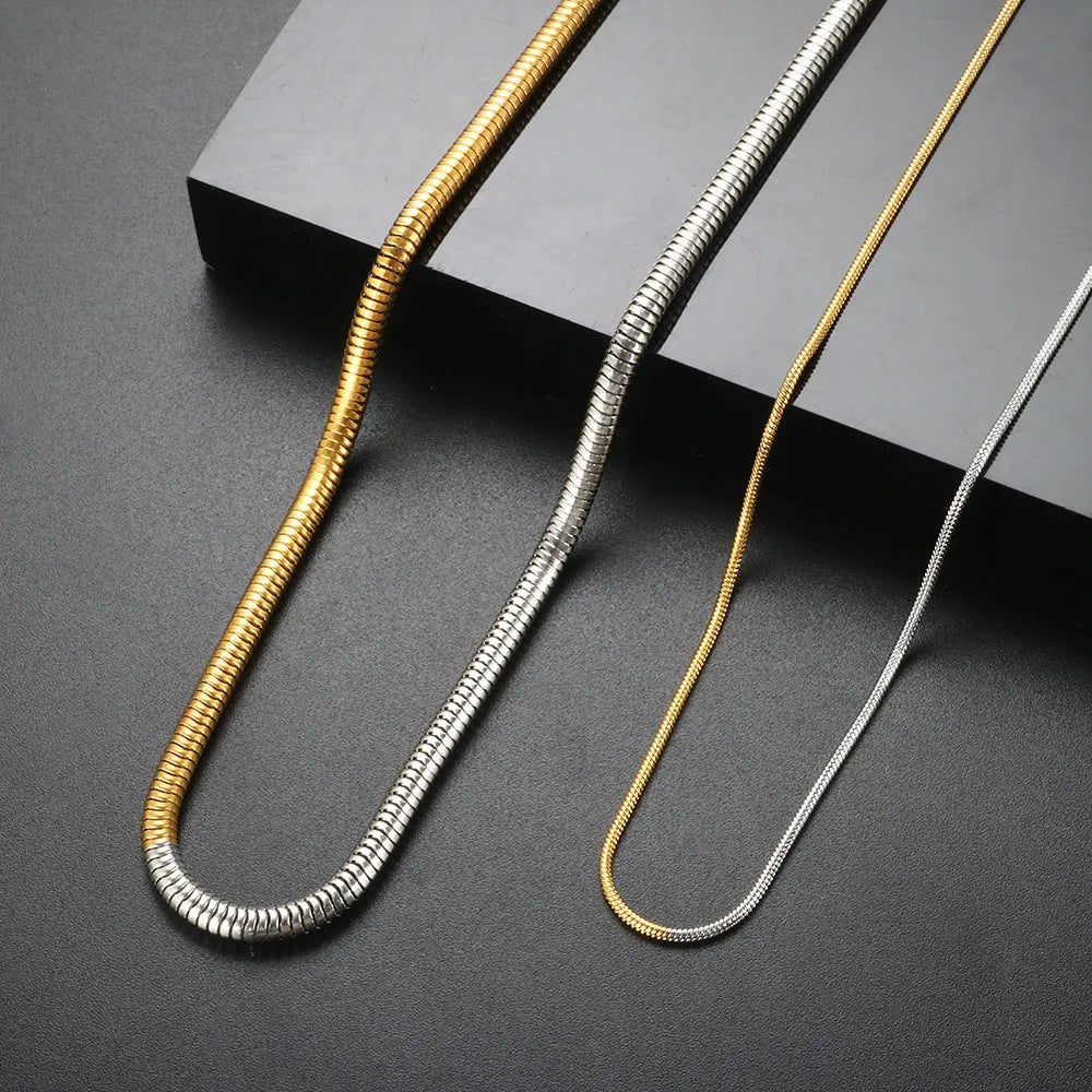 Gold colour stainless steel snake bones chain necklace with geometric lines, 3mm wide.