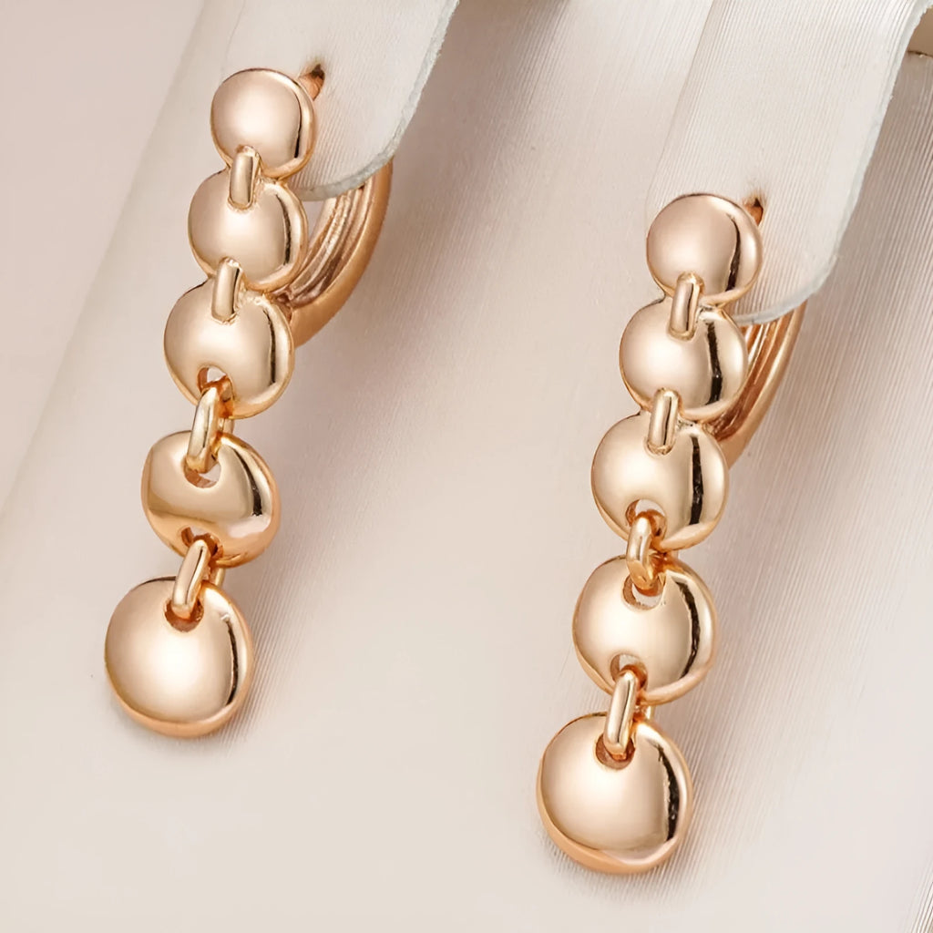 A pair of gold-coloured retro long circle earrings with a woven texture, for pierced ears.
