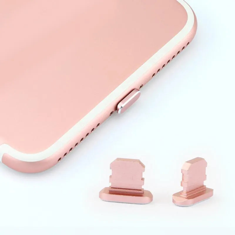Aluminium alloy iPhone charging port dust plug in multiple colours including gold, silver, blue, red, grey, black, and rose gold.