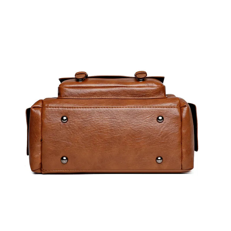 Vintage-style large capacity messenger bag in PU leather, showing contrast stitching and a horizontal square shape.