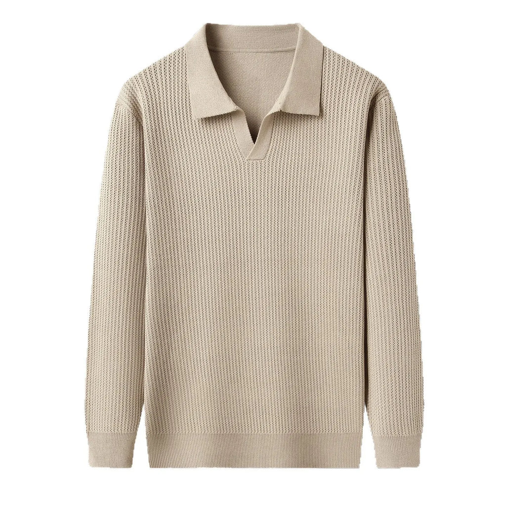 Man wearing a loose green pullover sweater, a casual autumn bottoming layer.