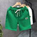 Polyester sports shorts in solid colours with micro elasticity for casual wear and beach activities