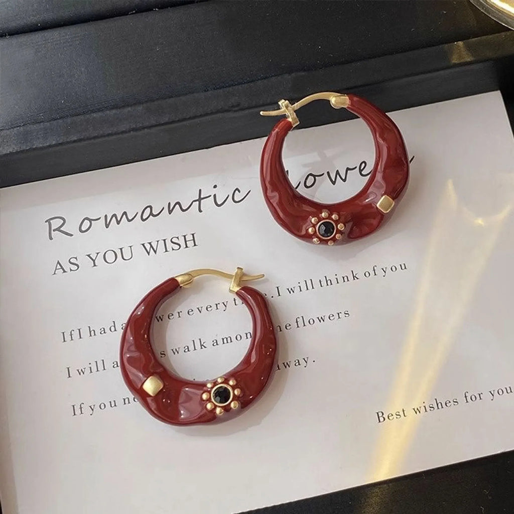 Retro alloy ear studs with dripping oil texture and rhinestone decorations in black or red colours