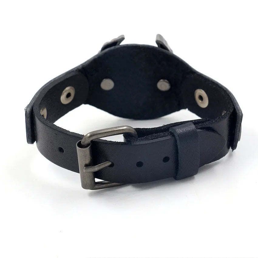 Black geometric leather bracelet with metallic eagle clasp showing 26cm length and varying width dimensions