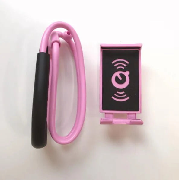 White 360-degree rotating universal smartphone holder on a table