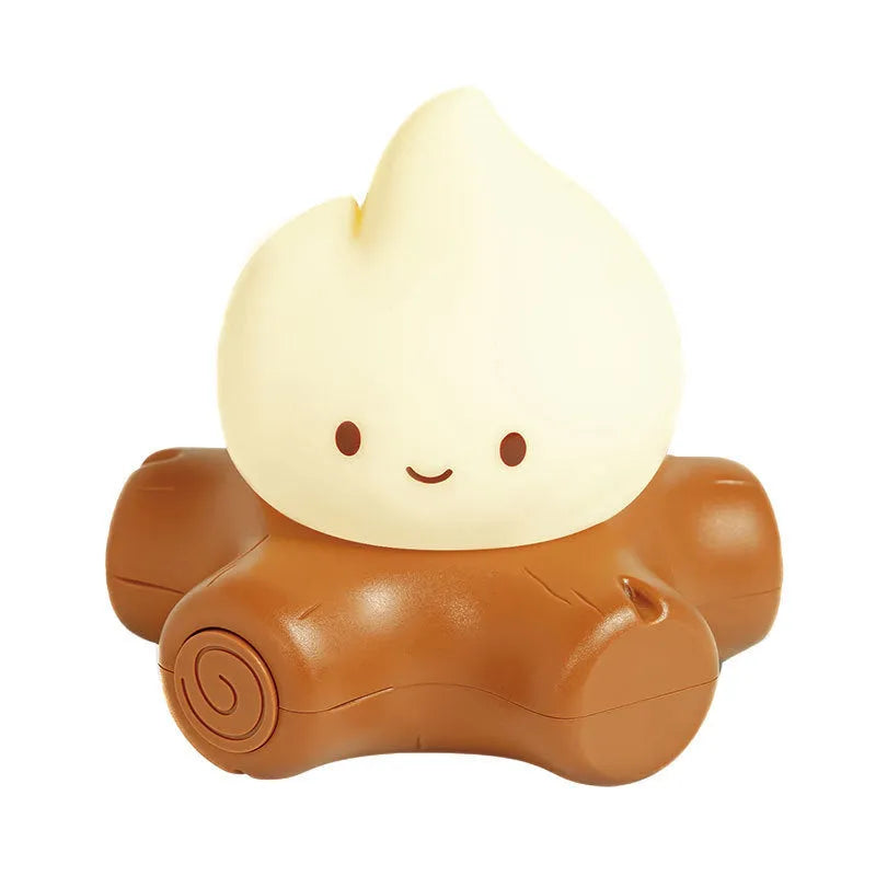 Small cartoon-style night lamp with silicone flame simulation on a table