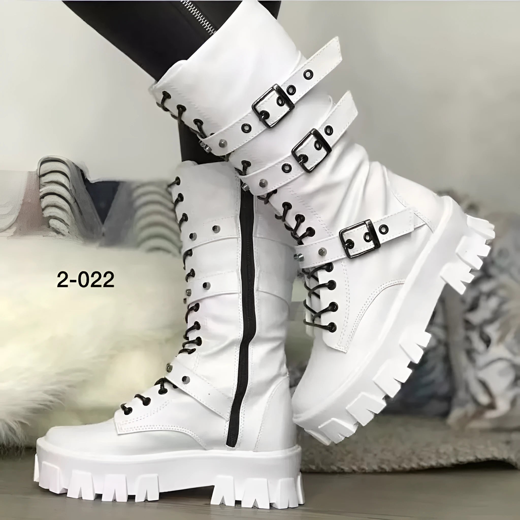 Women's black mid-calf knight boots with metal buckle and side zipper on a white background.