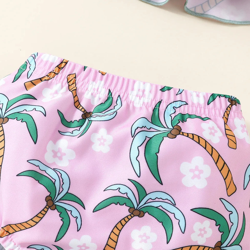 Girls' white two-piece swimsuit set with a shirt and matching shorts on a hanger