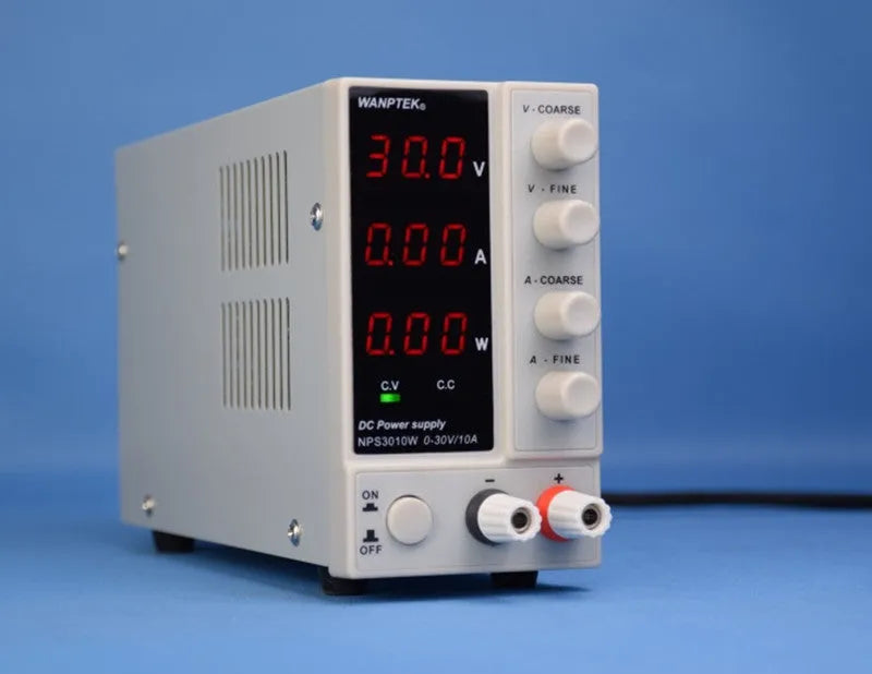 White NPS605W adjustable DC bench power supply with digital displays for voltage and current settings.