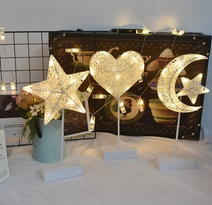 Rattan and PC LED star, heart, and moon shaped battery operated decorative lamps.