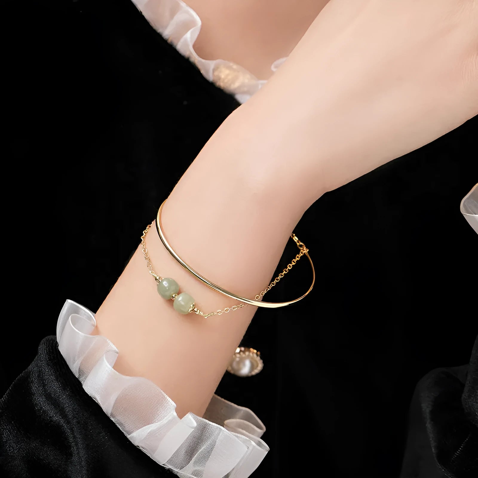 Women's jade lucky beads bracelet with gold inlay in single, double, and three bead versions.