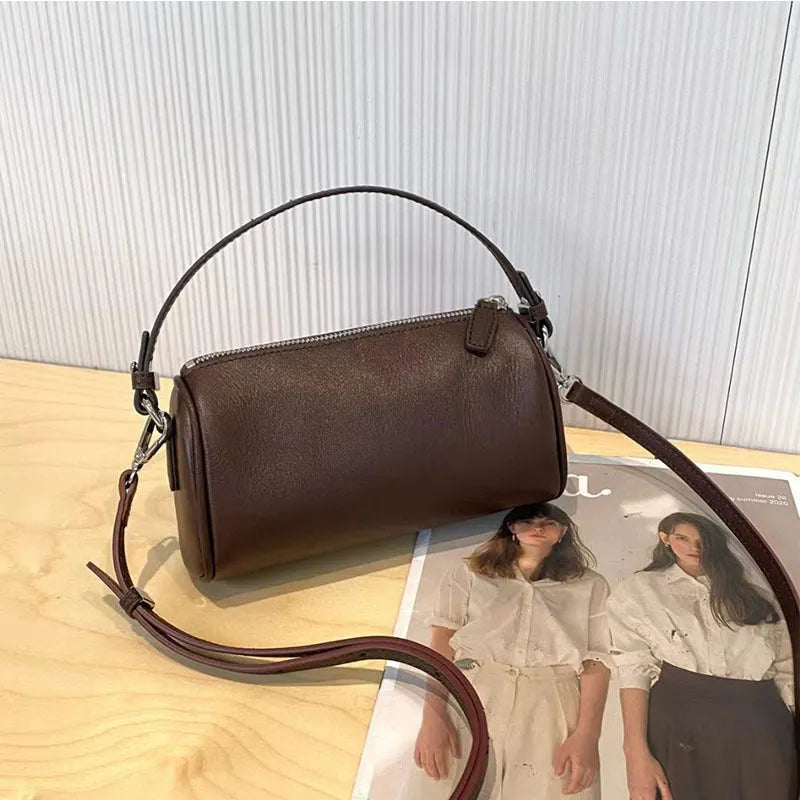 Cylindrical leather crossbody phone bag in vegetable tanned genuine leather with sewing thread detailing