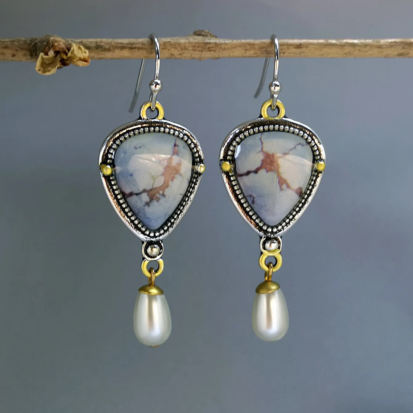 Retro blue geometric drop earrings with synthetic opal and white pearl details on electroplated metal.