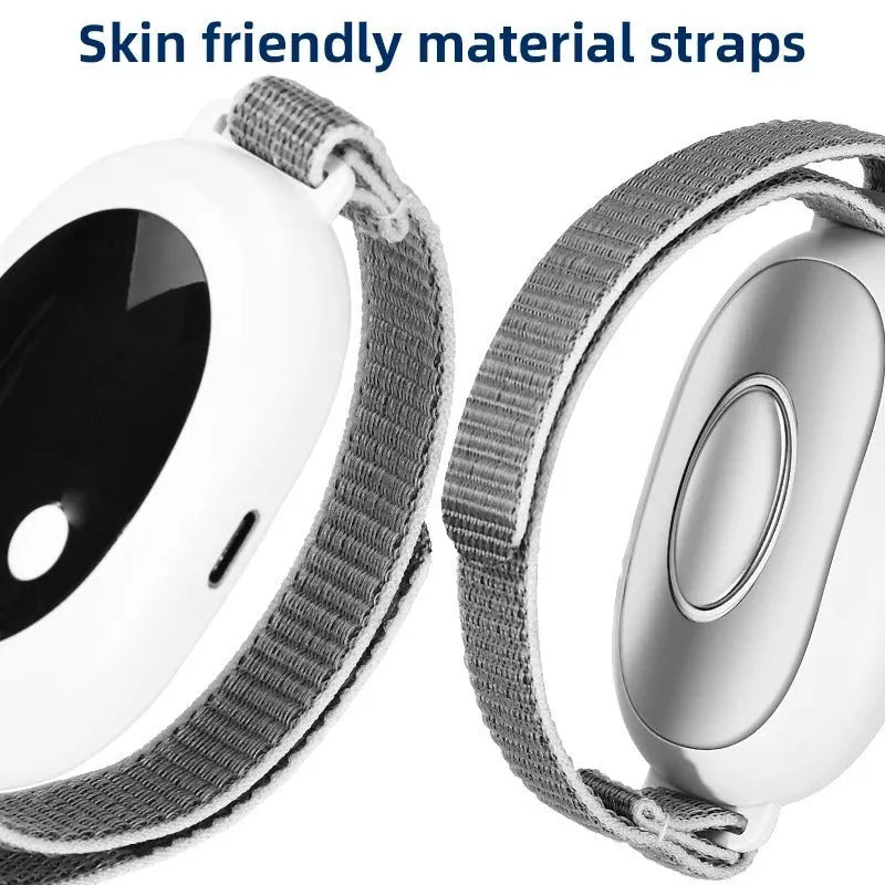 White handheld sleep aid remote control with digital display, charging cable, and wearable sleep bracelet on a flat surface.