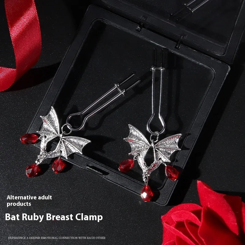Silver bat nipple clamp with ruby design and adjustable pressure mechanism