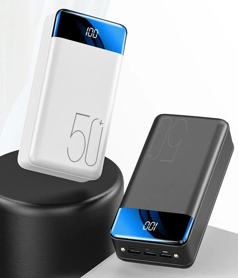 Large capacity 50000mAh power bank with three USB ports in black or white plastic casing
