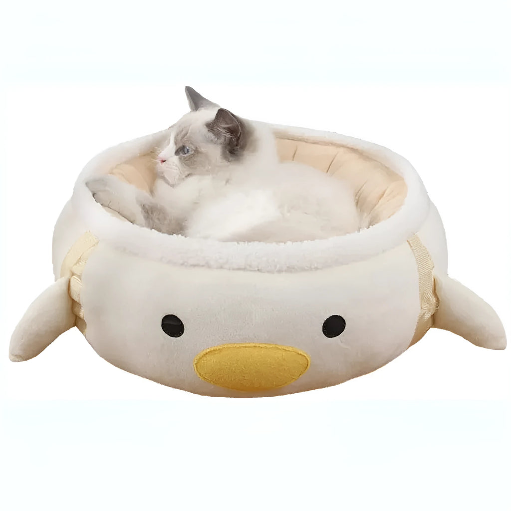 Green chick-shaped cat bed shown both flat and hanging as a hammock, suitable for small pets.