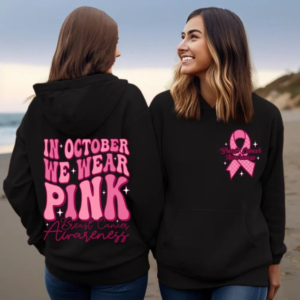 Retro print breast cancer awareness pullover hoodie with side seam pockets in pink.