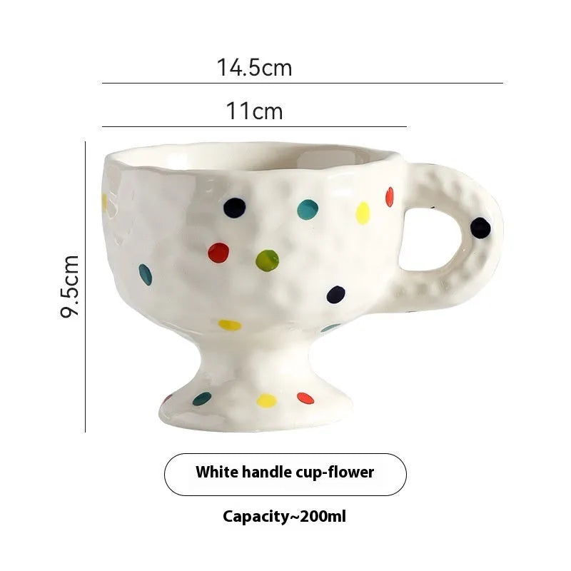 Hand-pinched irregular shaped ceramic mug in a solid colour, modern simple design