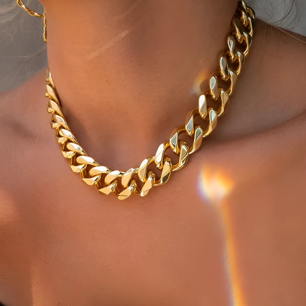 Women's gold chunky chain necklace showing thick links and pendant detail