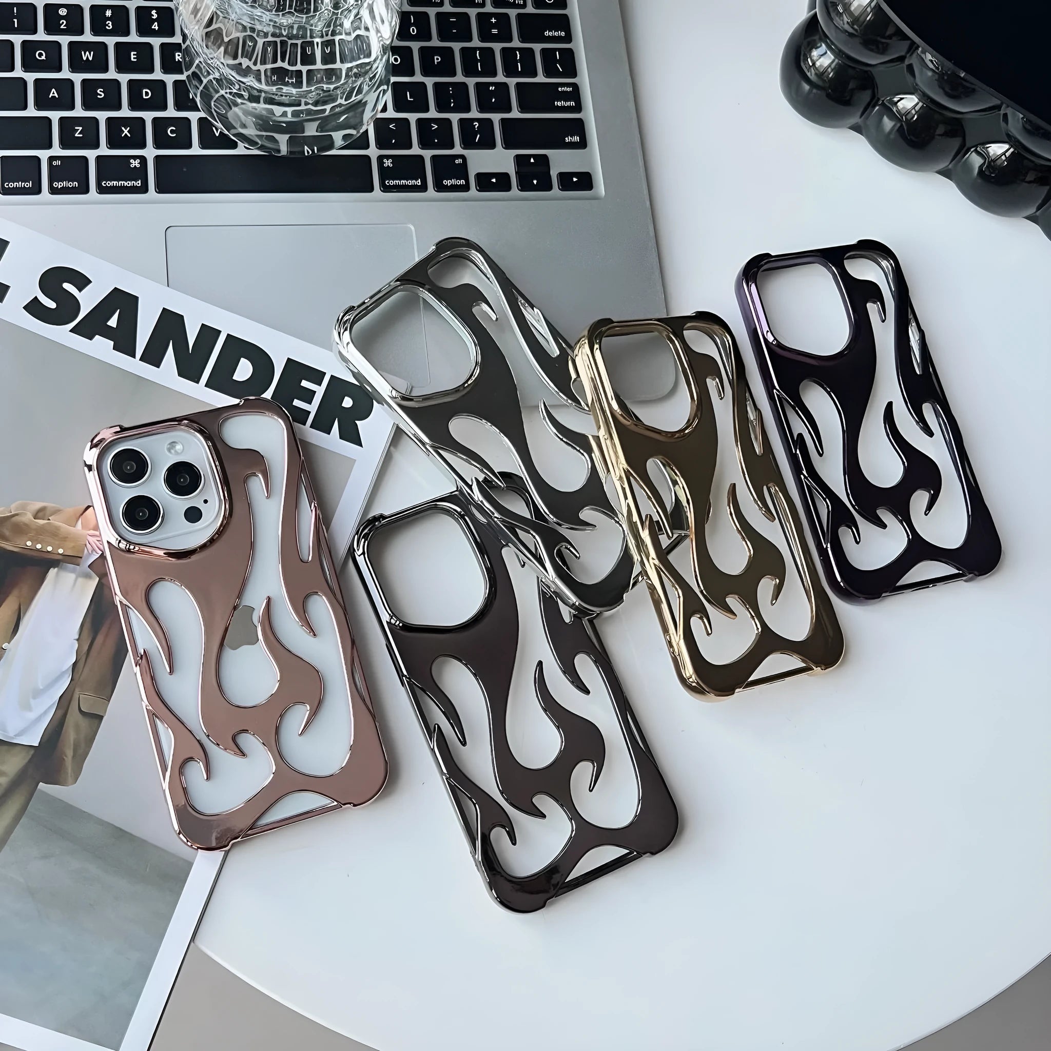 Electroplated hollow flame pattern soft TPU phone case for Apple iPhone in silver finish.