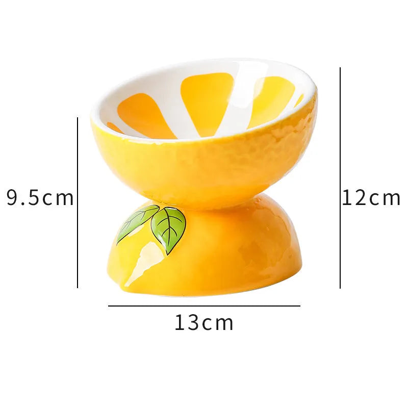 Ceramic raised cat bowl in orange pattern, showing tilted wide-rim design on elevated stand.