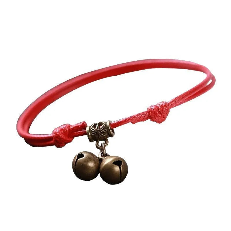 Nylon rope dog collar with brass bell shown in black, red, and coffee colour options on a plain background.