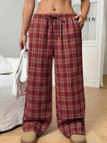 Women's blue and red plaid casual trousers with drawstring waist and side pockets.