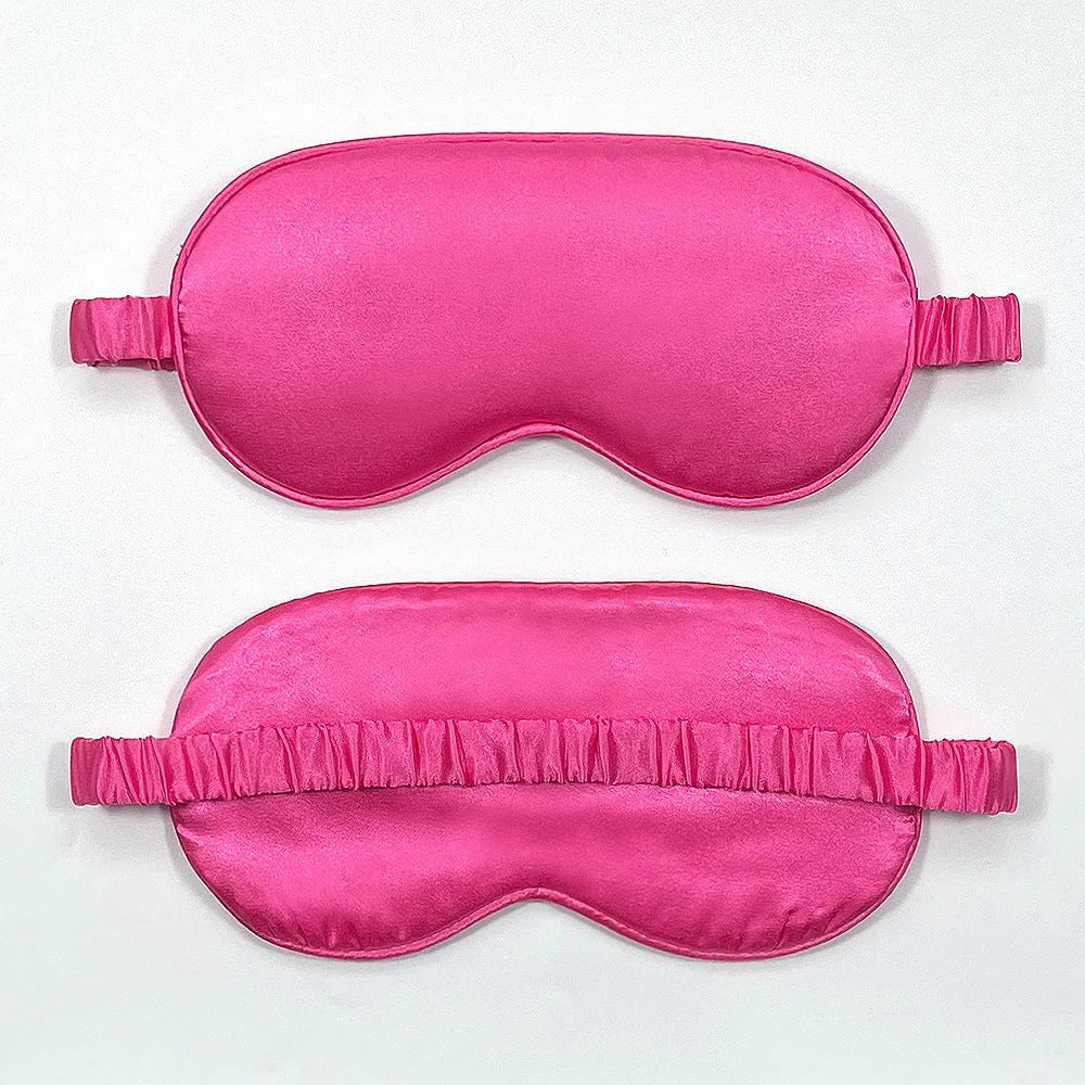 Double-sided silk-like sleep mask in rayon satin, shown in multiple colour options on a white background.