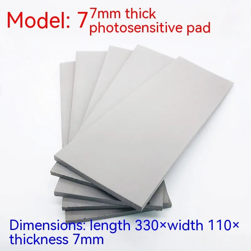 Black and grey plastic photosensitive mat for seal pottery, showing 330mm by 110mm sheet size.
