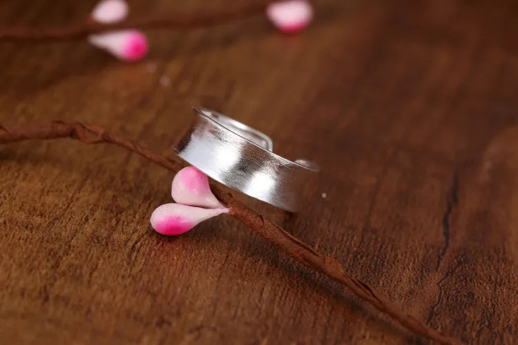 Adjustable opening geometric frosted sterling silver ring with open design