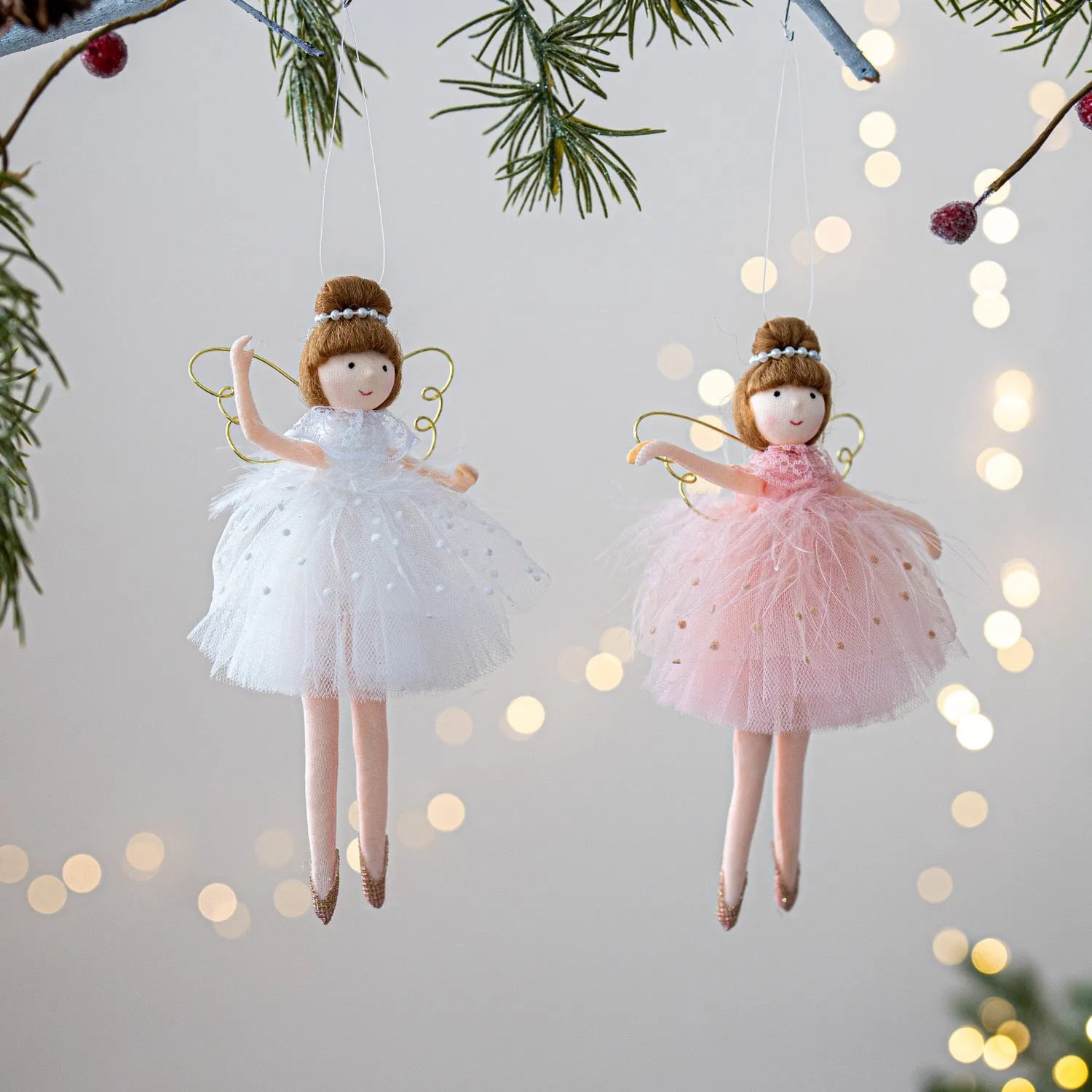 Pink cloth ballet girl plush doll with angel wings and pendant design on white background