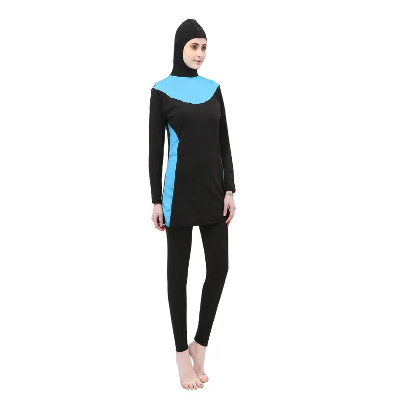 Conservative women's hooded long sleeve swimsuit in black with colour trim.