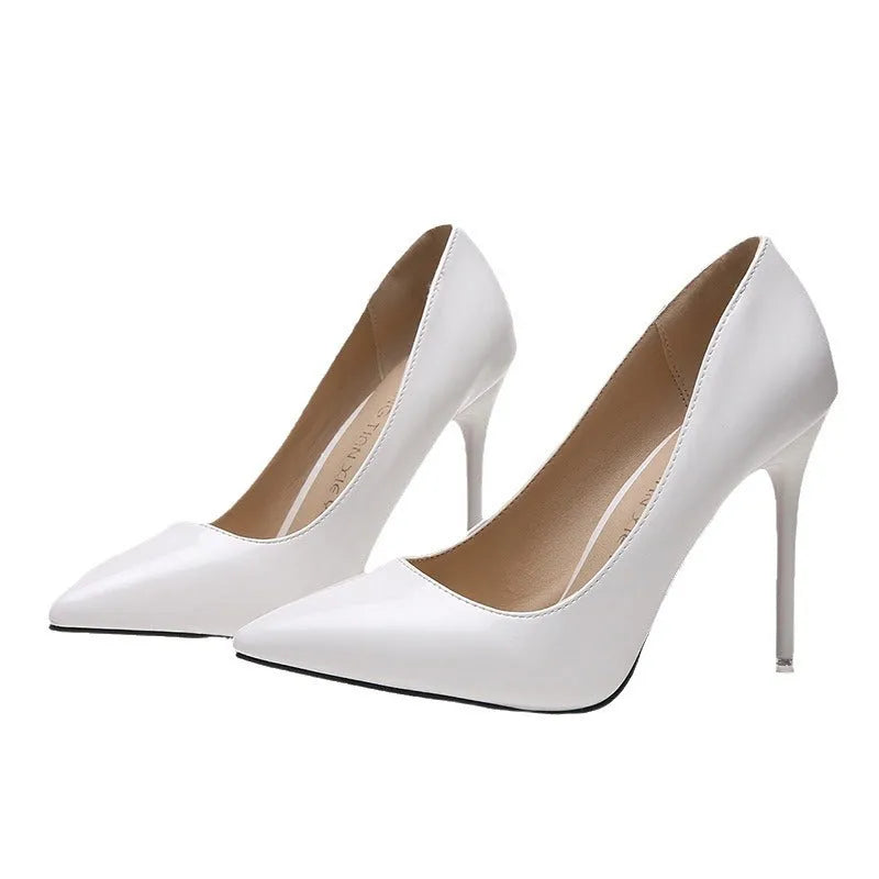 Women's apricot pointed toe stiletto high heel pump with super high heel on a rubber sole.