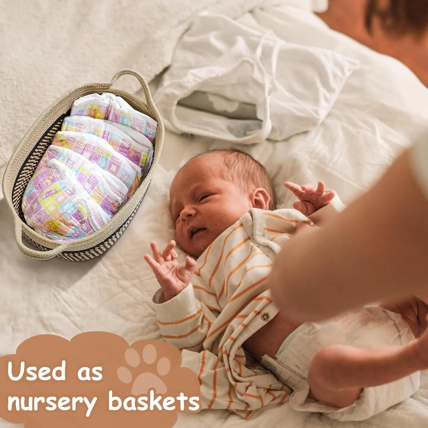 Light beige handmade cotton rope storage basket with handle on a wooden surface.
