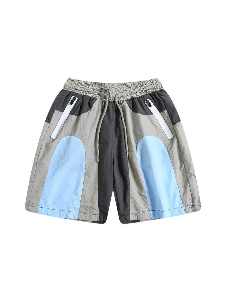 Blue patchwork men's beach shorts with elastic waist and above-knee length for outdoor sports