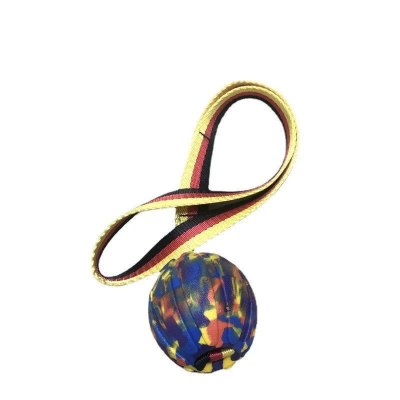 Floating EVA pet training ball in camouflage or yellow colours with attached string, shown in 6.5cm, 7cm, and 9cm diameter sizes