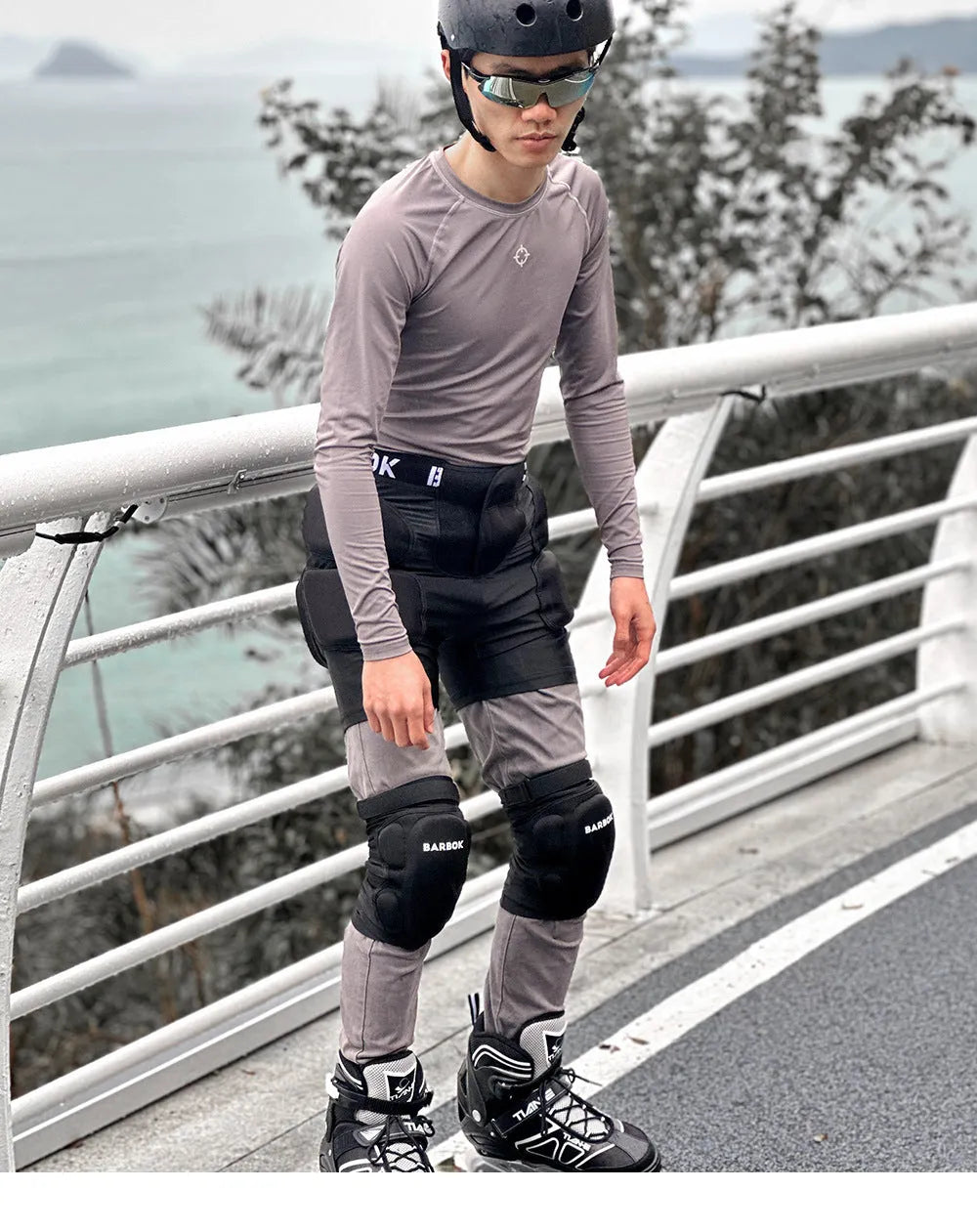 Black adult hip protection shorts with removable padding for skating and skiing safety.