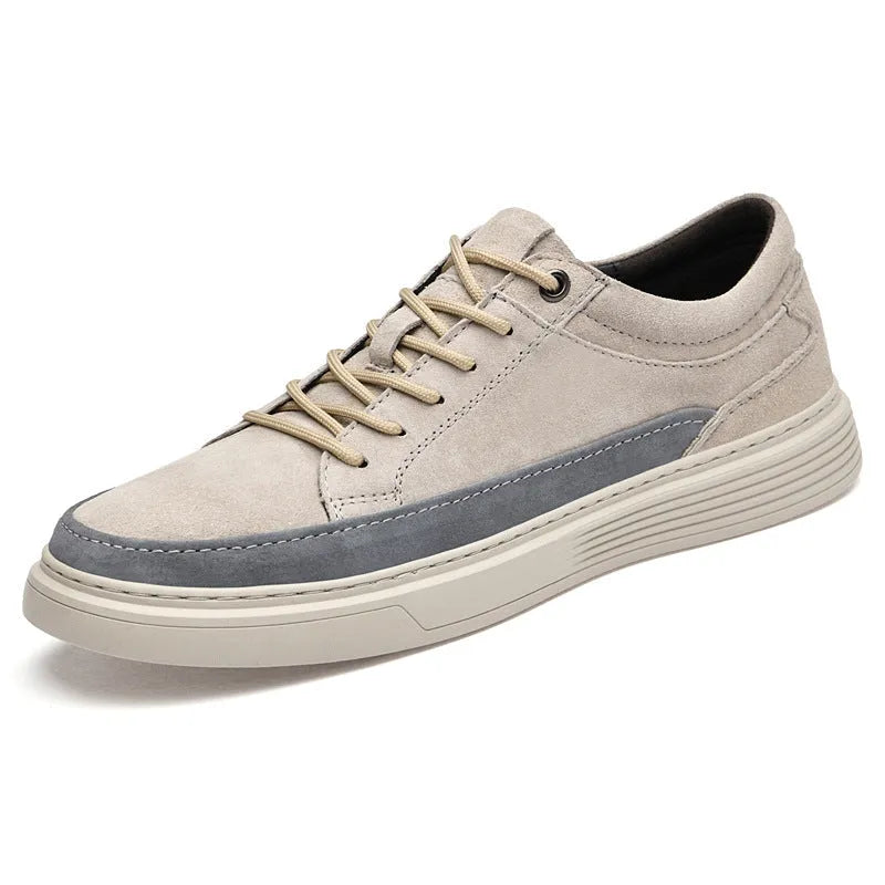 Men's grey casual skate shoes with pigskin upper and rubber sole, shown with front lace-up design and round toe