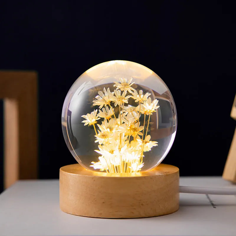 3D dandelion eternal flower inside a luminous resin crystal ball on a beech wood stand base.