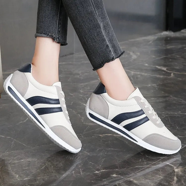 Red and blue lace-up leisure sneakers with soft rubber soles and mesh upper