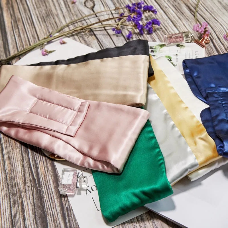 Mulberry silk sleep mask shown in one of seven colours: black, champagne gold, navy blue, silver grey, white, pink, or green.