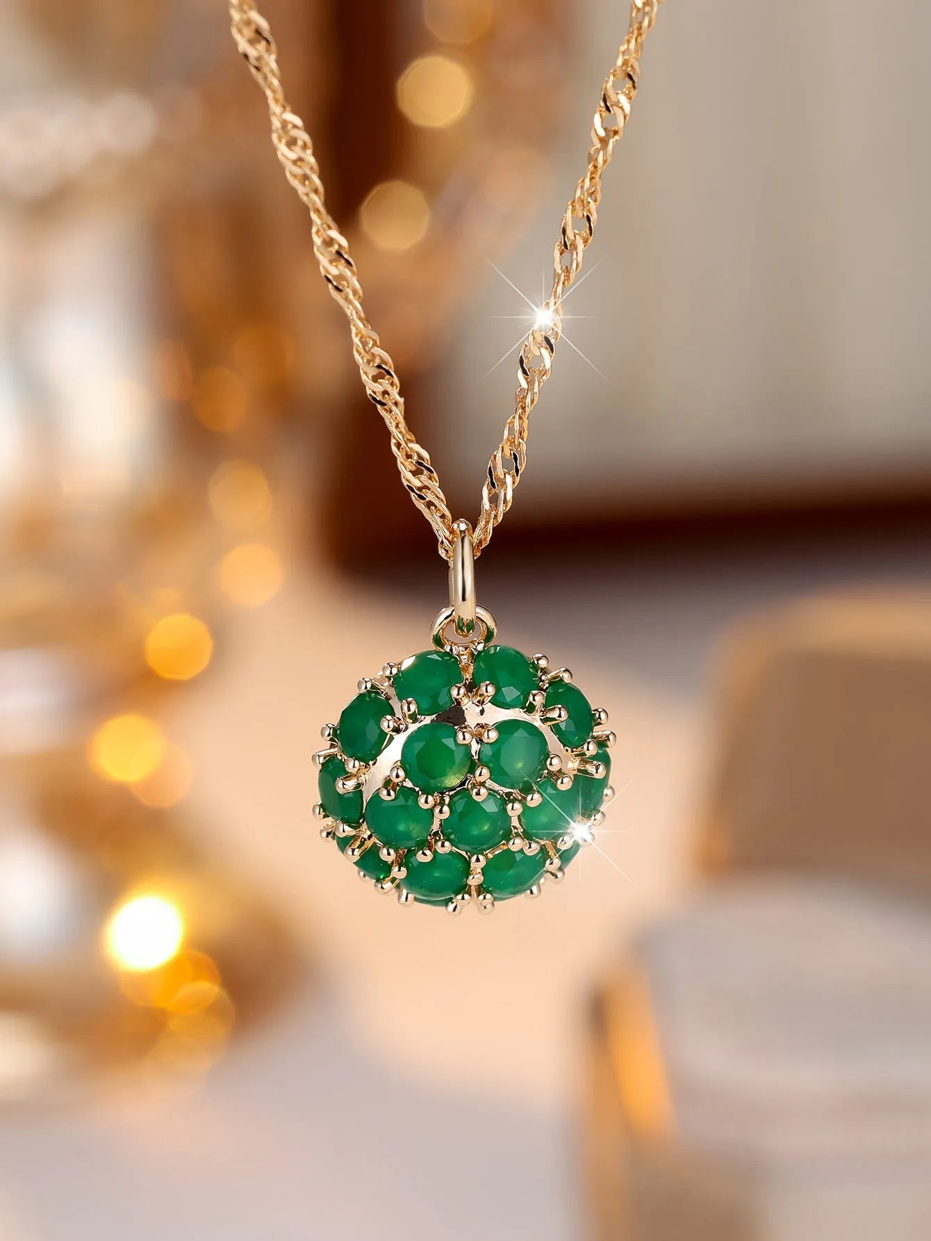 Champagne gold round emerald and diamond pendant necklace on a copper chain