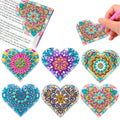 Set of six purple PU leather handmade bookmarks with flower shapes and clear stick-on crystals.