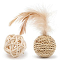 Two cat toys: hollow rattan ball and faux feather ball with bell on wooden floor