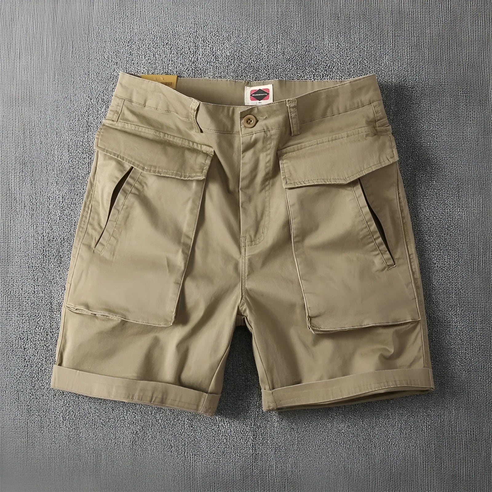 Men's straight-leg cotton cargo shorts in khaki with multiple pockets, shown on a model.